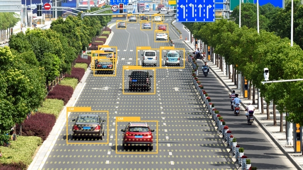 An elevated view of a roadway where cars are identified using a vision model